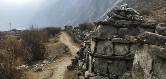 Stone mane wall between LangTang Village and Kyanjing Gomba